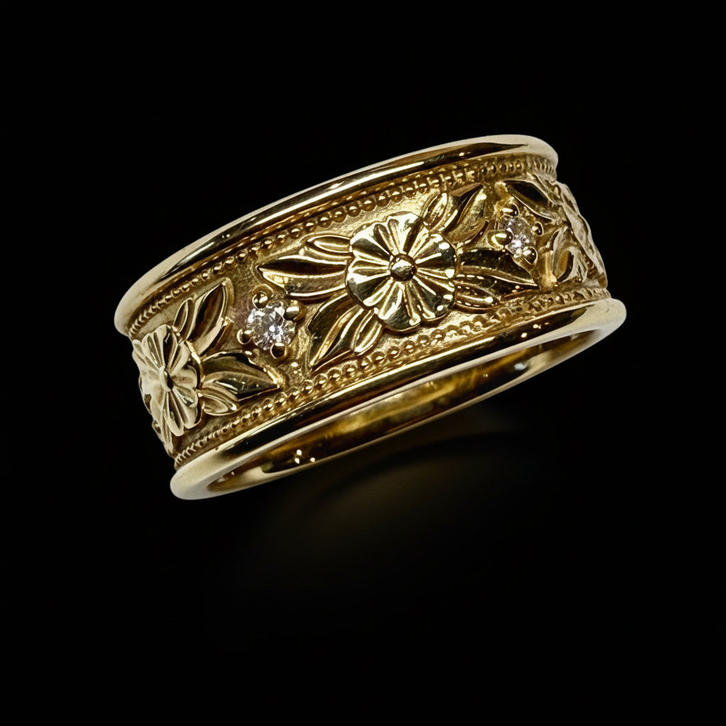 Gold ring with floral designs and a diamond on a light gray background
